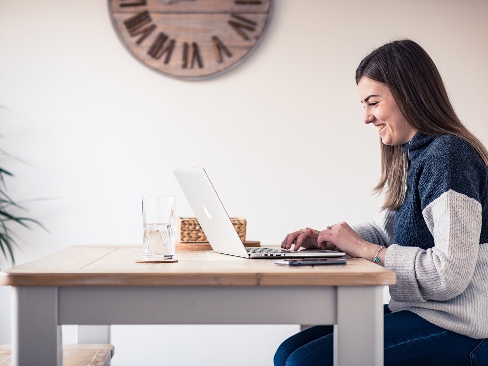 person working on laptop at table